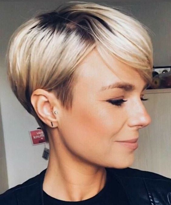 Pixie cut, Short hairstyles, Spring/summer trends, Low-maintenance, Versatility, Hair fashion, Hair color experimentation, Seasonal style, Timeless appeal, Bold statement, Facial feature enhancement, Spring fashion, Summer fashion, Haircut practicality, Haircut creativity, Chic look, Confidence, Edginess, Sophistication, Warm weather styling, Statement earrings, Trendy hats, Light, airy clothing, Floral prints, Bright colors, Big chop,