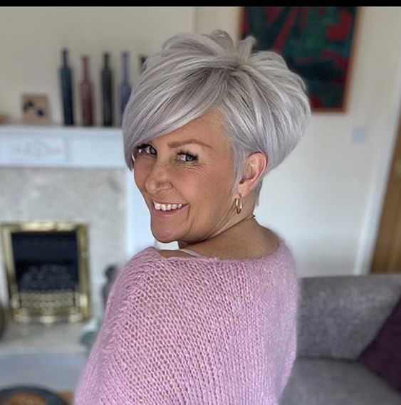 Pixie cut, Short hairstyles, Spring/summer trends, Low-maintenance, Versatility, Hair fashion, Hair color experimentation, Seasonal style, Timeless appeal, Bold statement, Facial feature enhancement, Spring fashion, Summer fashion, Haircut practicality, Haircut creativity, Chic look, Confidence, Edginess, Sophistication, Warm weather styling, Statement earrings, Trendy hats, Light, airy clothing, Floral prints, Bright colors, Big chop,