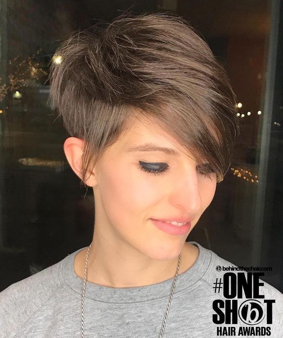 Pixie cut, Short hairstyles, Spring/summer trends, Low-maintenance, Versatility, Hair fashion, Hair color experimentation, Seasonal style, Timeless appeal, Bold statement, Facial feature enhancement, Spring fashion, Summer fashion, Haircut practicality, Haircut creativity, Chic look, Confidence, Edginess, Sophistication, Warm weather styling, Statement earrings, Trendy hats, Light, airy clothing, Floral prints, Bright colors, Big chop,