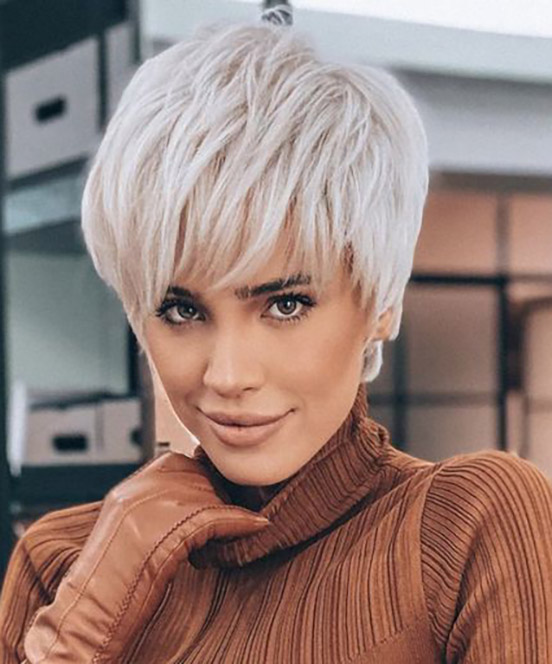 Pixie cut, Short hairstyles, Spring/summer trends, Low-maintenance, Versatility, Hair fashion, Hair color experimentation, Seasonal style, Timeless appeal, Bold statement, Facial feature enhancement, Spring fashion, Summer fashion, Haircut practicality, Haircut creativity, Chic look, Confidence, Edginess, Sophistication, Warm weather styling, Statement earrings, Trendy hats, Light, airy clothing, Floral prints, Bright colors, Big chop,