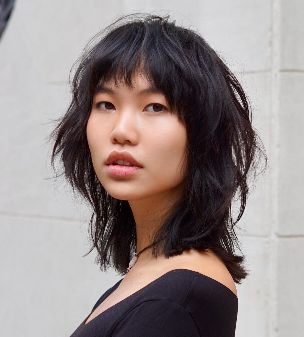 Medium Layered Haircuts with Bangs